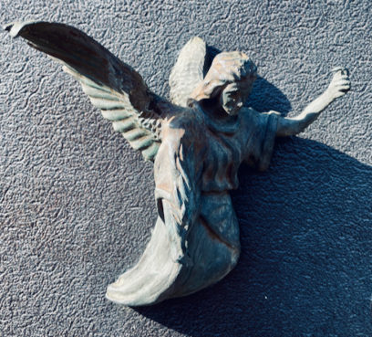 angel on cemetery gate